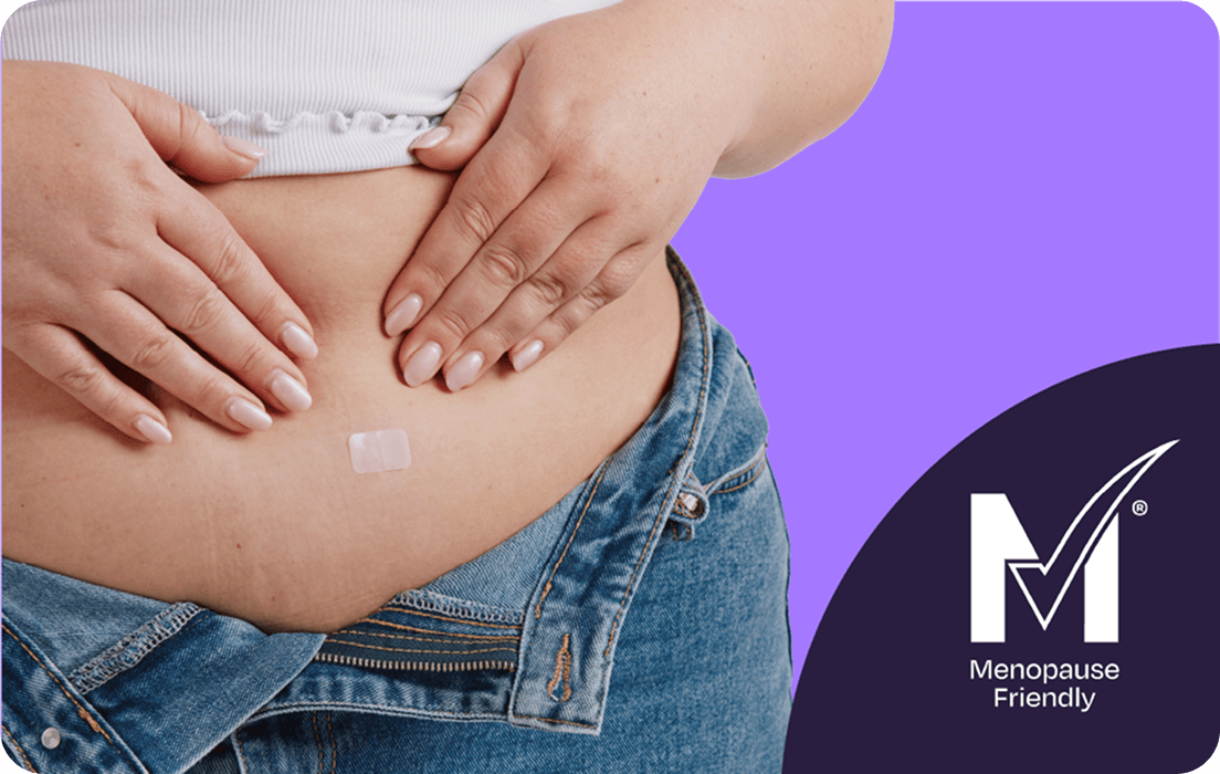 A person places a small patch on their abdomen above unzipped jeans. The background is purple with a Menopause Friendly logo