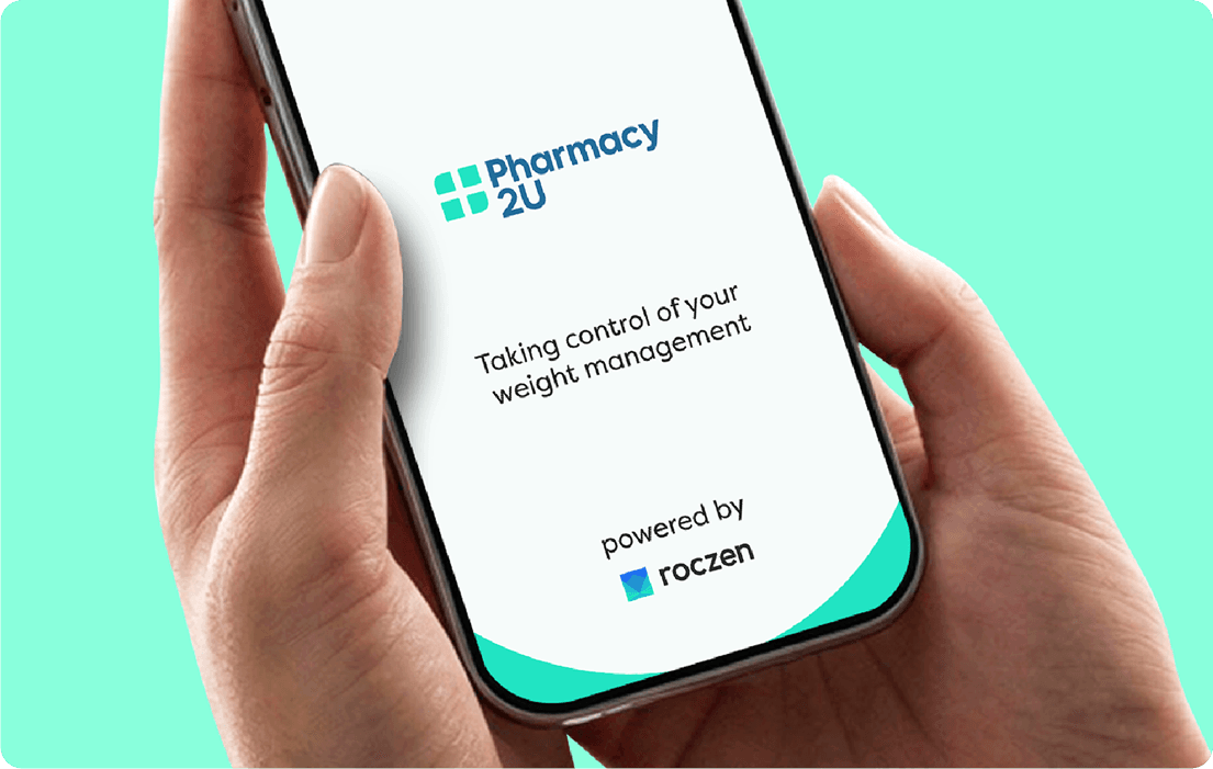 Hands holding a smartphone displaying a Pharmacy 2U app screen with the text Taking control of your weight management, powered by roczen.