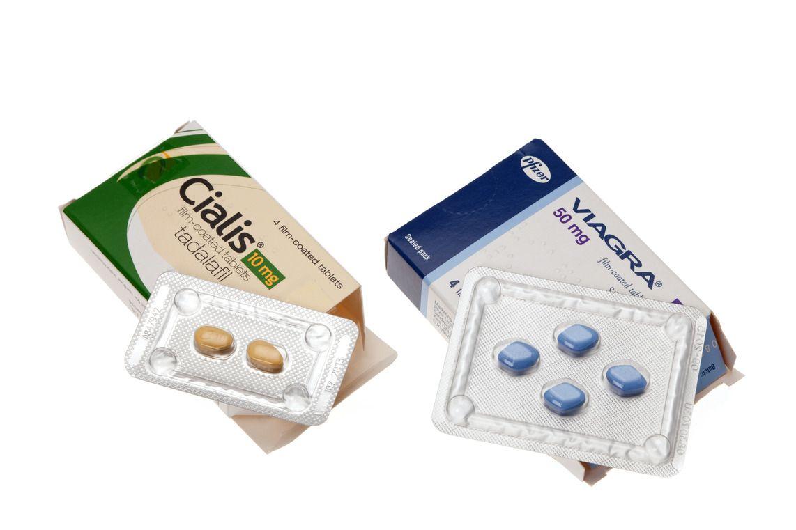 Cialis (tadalafil) packet and Viagra (sildenafil) packet with tablets