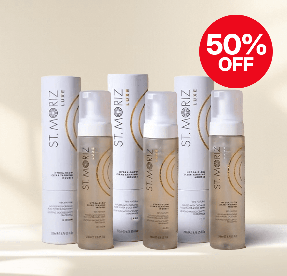 St. Moriz tanning mousse bottles with a 50% off red sticker, featuring hydra-glow clear formula.