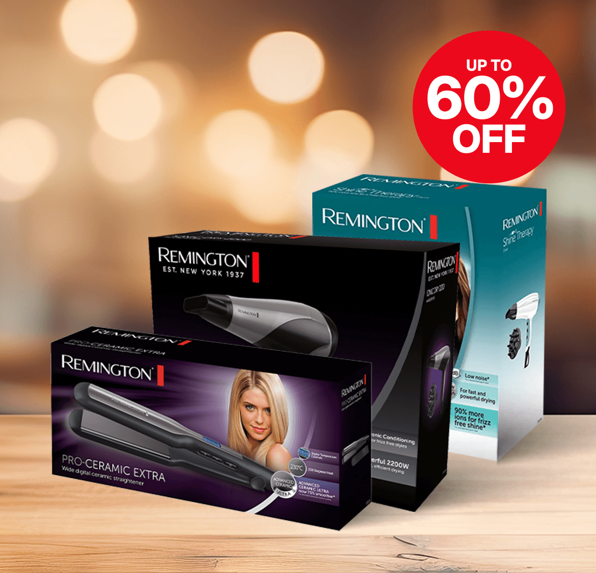Three Remington hair styling product boxes on a wooden table with a blurred background. A red label states "Up to 60% Off."
