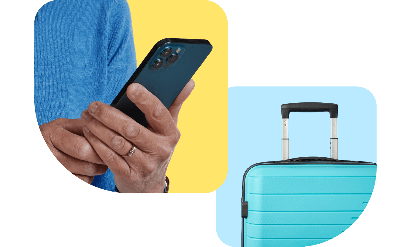 A person wearing a blue sweater holds a smartphone, next to a blue suitcase with an extended handle.