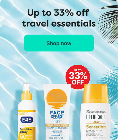 Banner showing travel essentials with up to 33% off, featuring sunscreen bottles on a water background. "Shop now" button on the right.