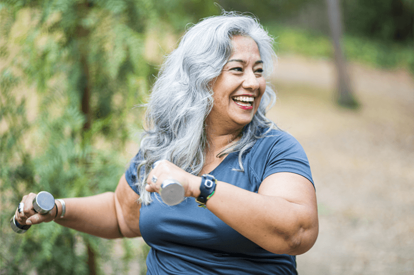 weightloss image, woman working out with weights outside