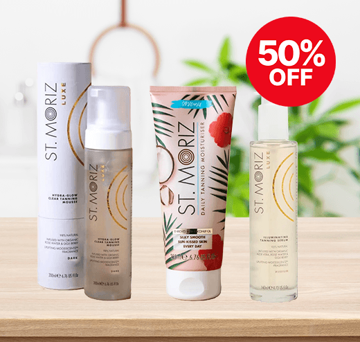 Four St. Moriz tanning products displayed on a wooden surface with a red "50% off" label.