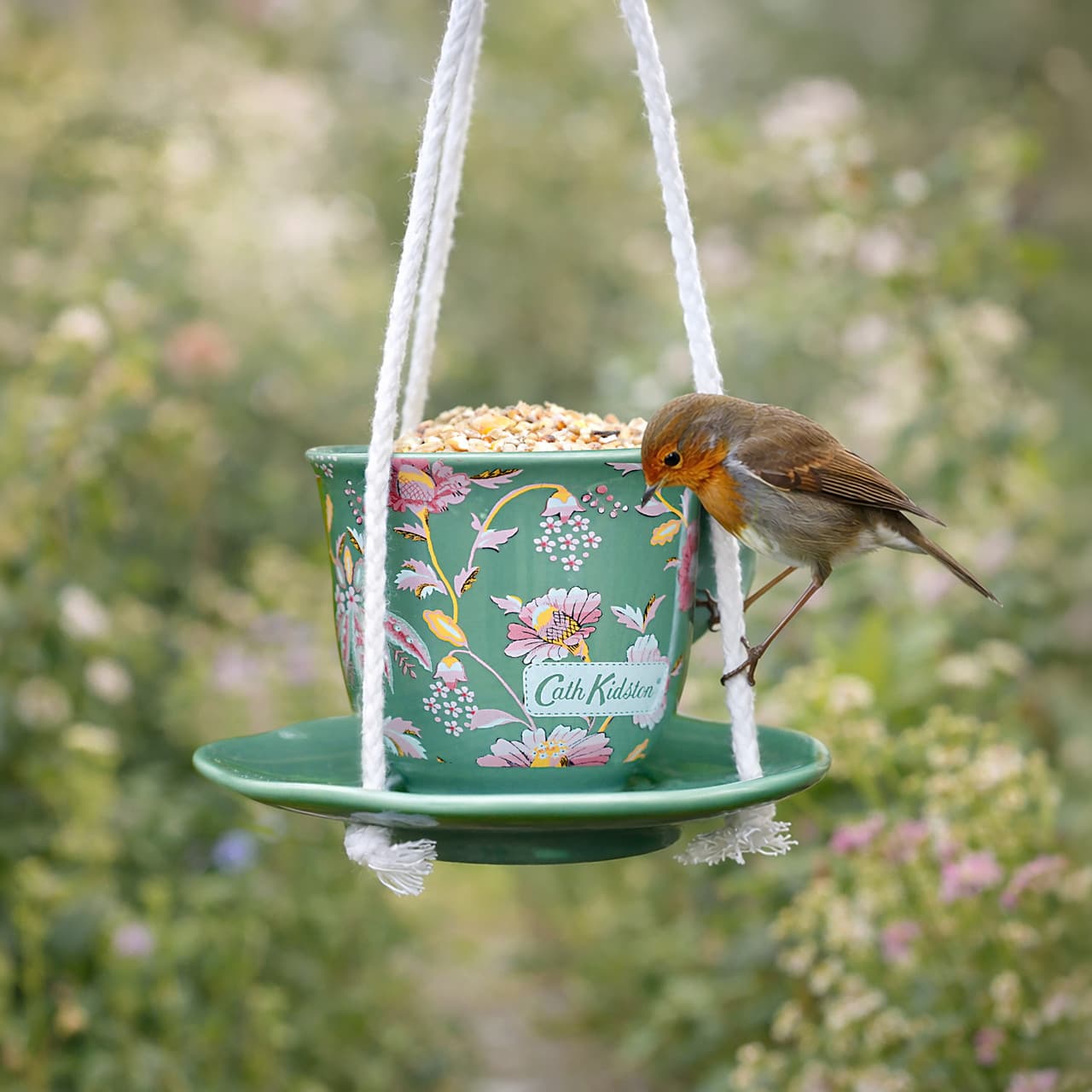 Cath Kidston Green Floral Ceramic Teacup Feeder Image https://cdn11.bigcommerce.com/s-g585yu857h/images/stencil/1280w/products/18107/42283/0167943_5028804502846_4_Cath_Kidston_Friendship_Garden_Teacup_Feeder_6__31061.1793194595.jpg1